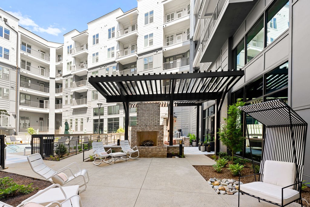 Alton Mill District Apartments in Charlotte, North Carolina Poolside Patio with Fireplace