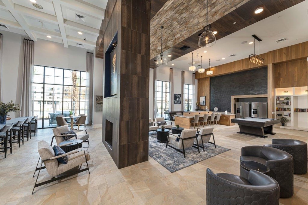 Alton Southern Highlands Apartments in Las Vegas, Nevada Clubhouse with Fireplace and Plush Reclining Seating