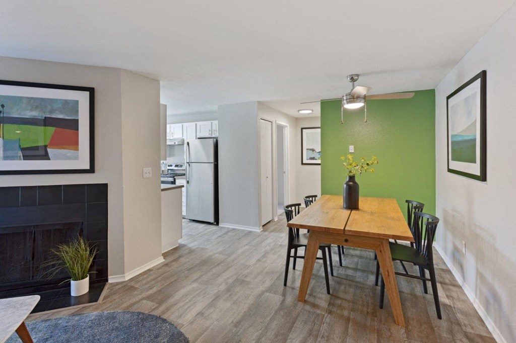 Alvista 23 Apartment Homes Model Living Room with Fireplace and Dining Area