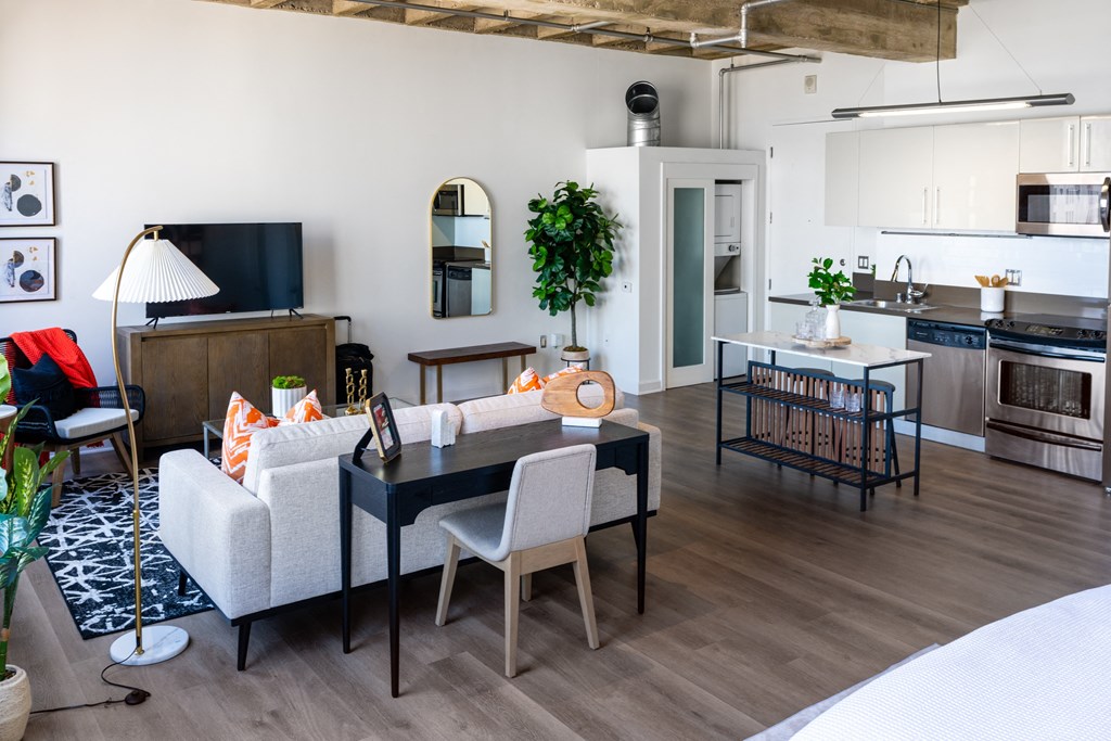 a living room with a couch and a dining table
