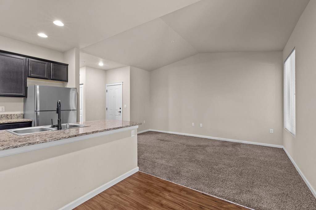 Little Tuscany Apartments & Townhomes - Apartment Living Room, Dining Room, Kitchen, and Breakfast Bar View