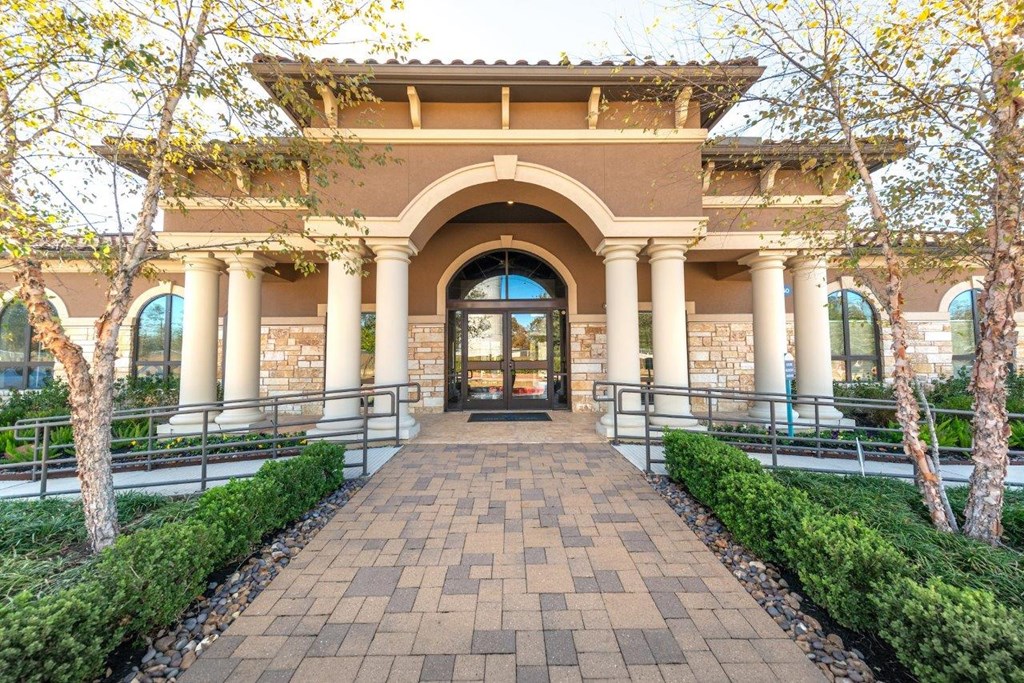 a building with columns and an arched doorway