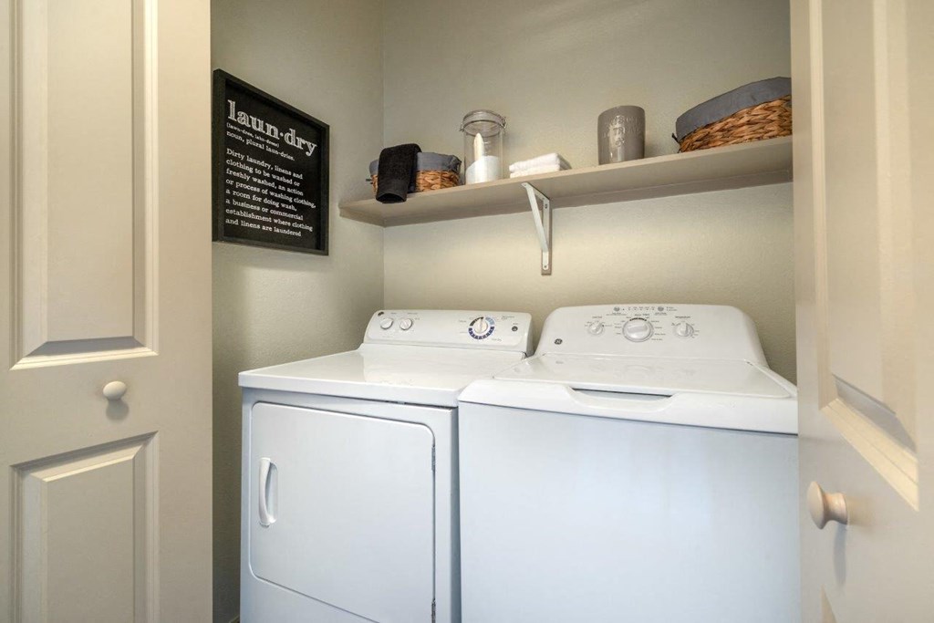a white washer and dryer in a room