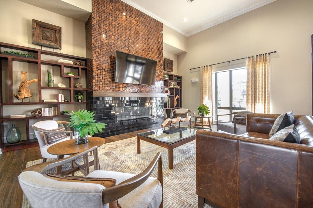 a living room with a fireplace and a tv on the wall