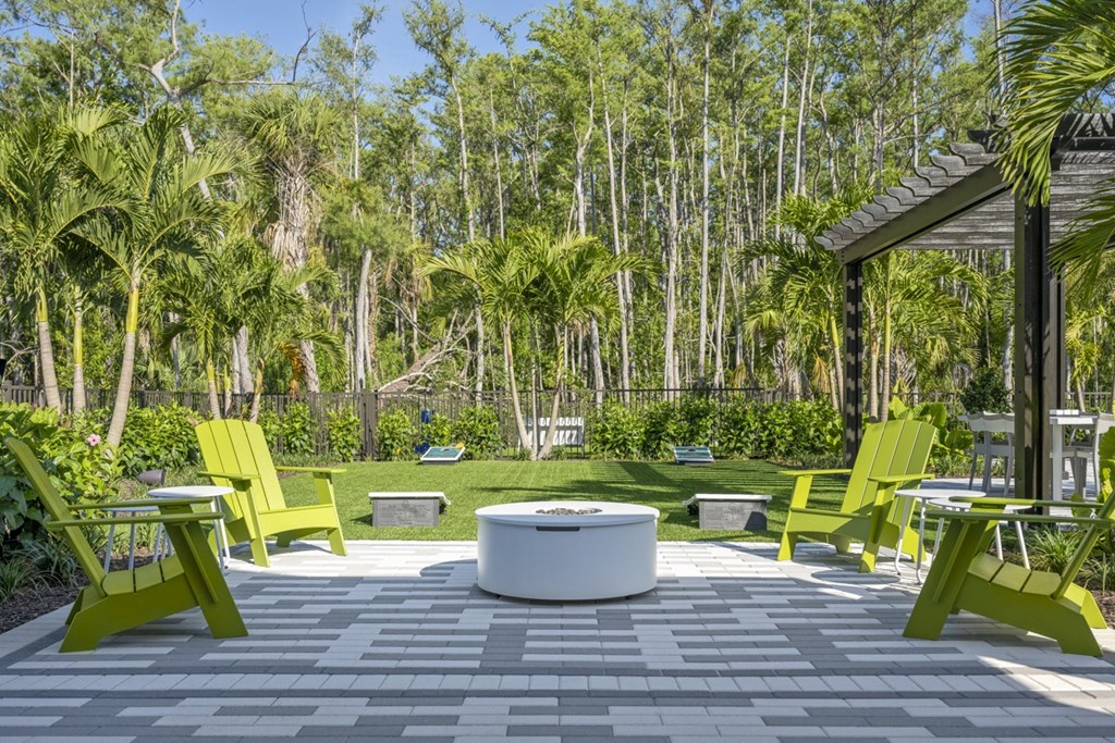 Argos by Soltura Rental Homes patio with chairs and a fire pit