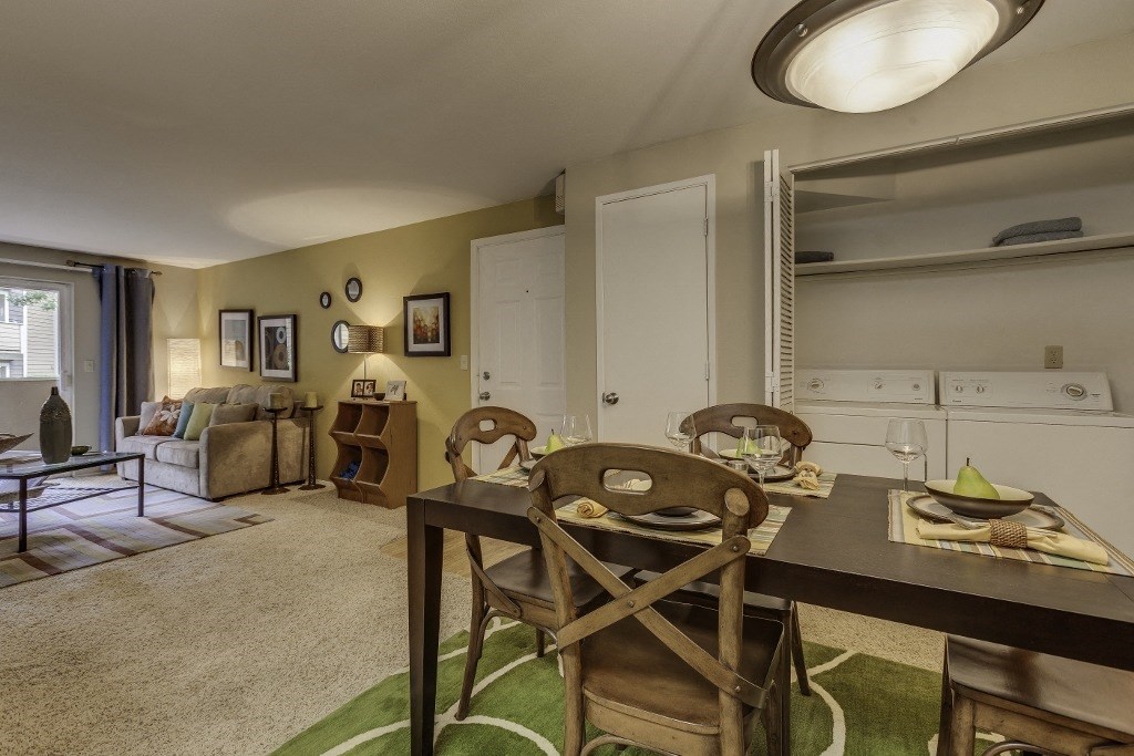 an open living room and dining room with a table and chairs