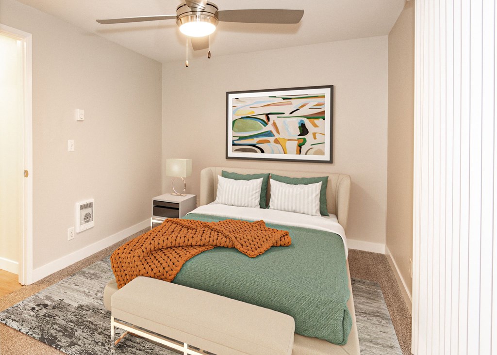 a bedroom with a bed and a ceiling fan