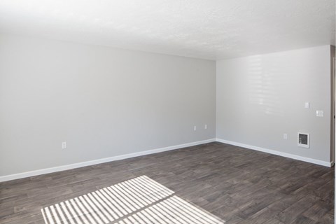 A room with a striped rug on the floor.