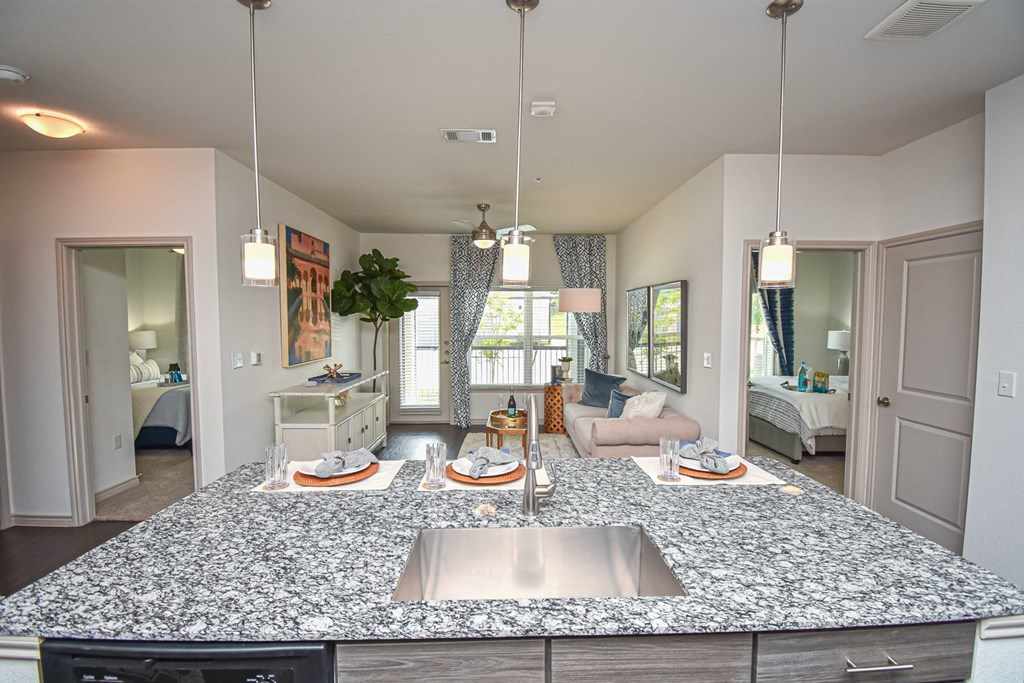 Aspire at Live Oak Kitchen and Living Room Area with Private Patio