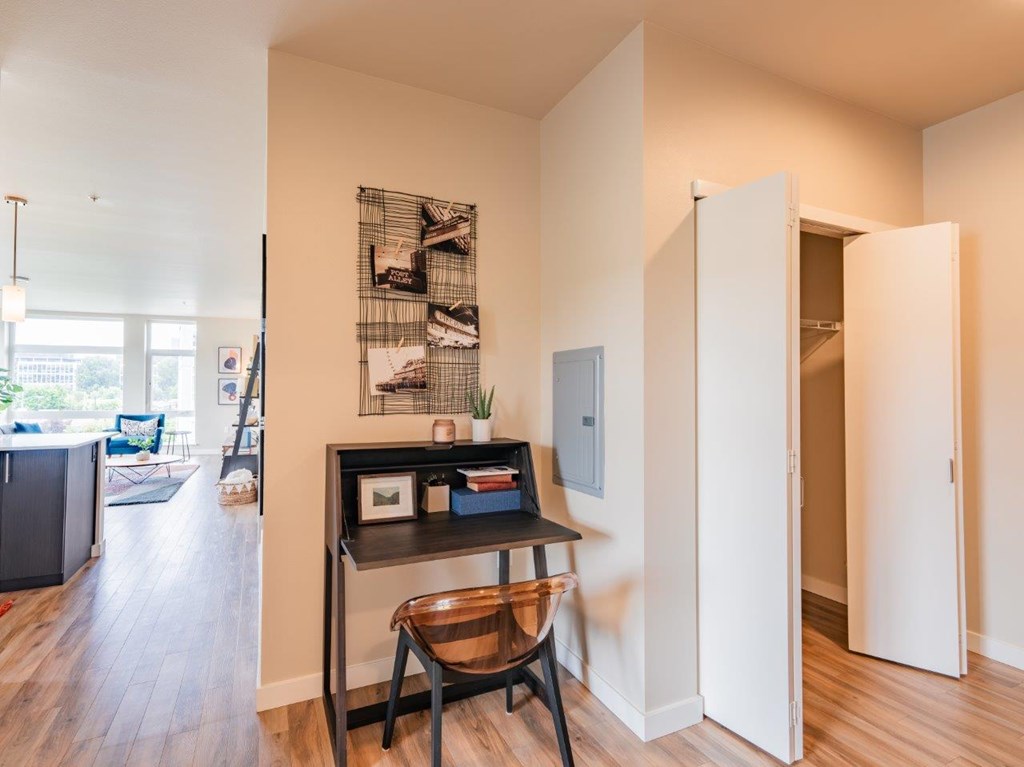 A room with a desk and chair in it.