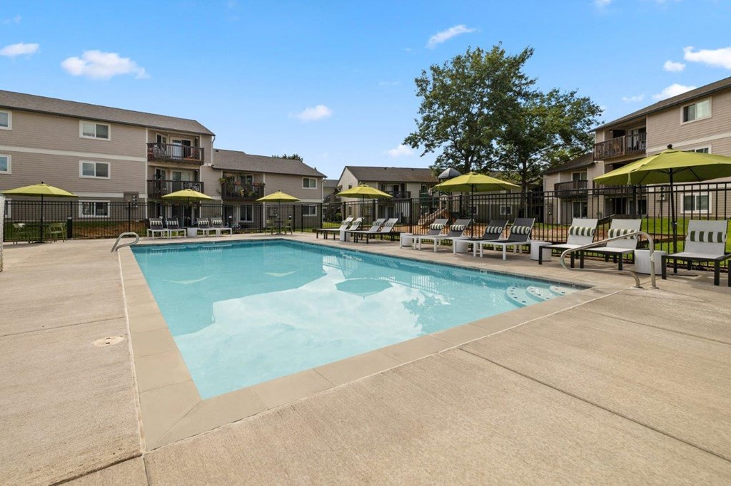 Atrio Apartments Pool with Lounge Chairs