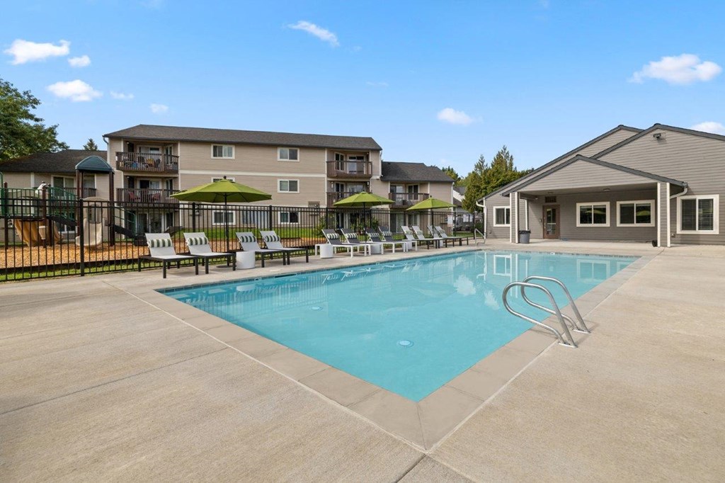 Atrio Apartments Pool with Lounge Chairs
