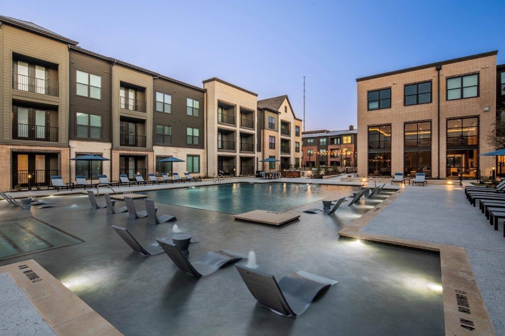 Aura 3Twenty Apartments in McKinney, Texas Pool with Lounge Chairs