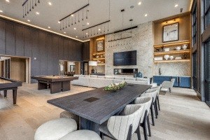 a large dining room with a large table and chairs