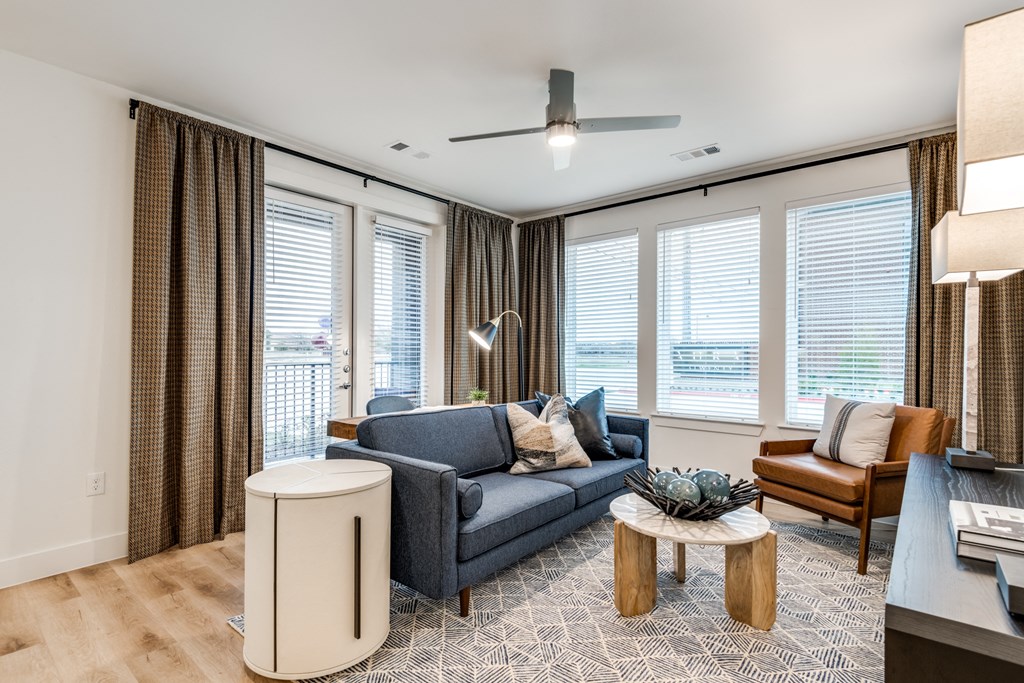 Aura 3Twenty Apartments living room with a couch and a coffee table