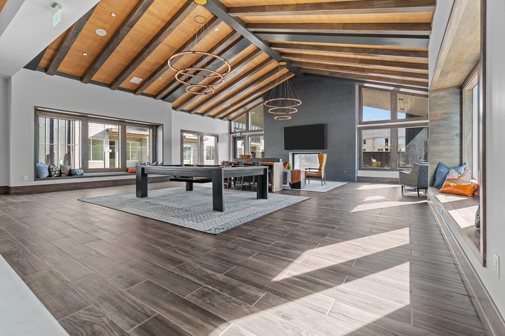 a large living room with a pool table
