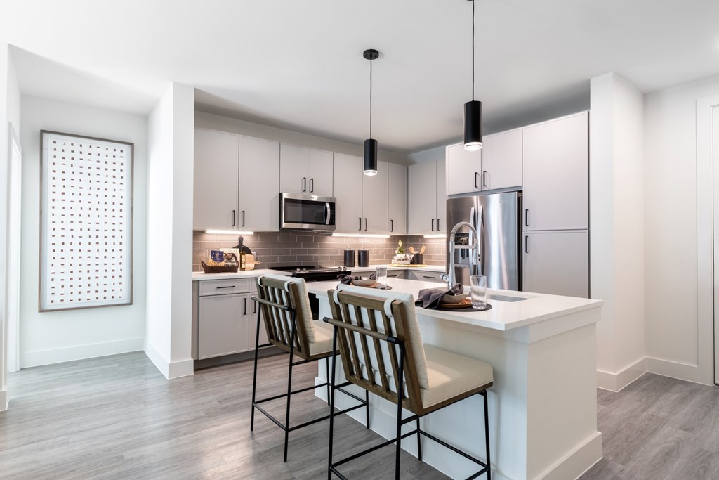 Aura Main Street Apartments in Lewisville, Texas Model Kitchen with Island