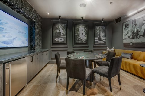 A modern dining room with a glass table and chairs.