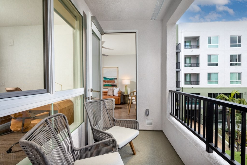 Park on First Apartments B3 Model Balcony with Patio Chairs