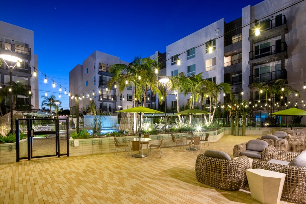 Park on First Apartments Pool Area and Lounge Chairs at Night