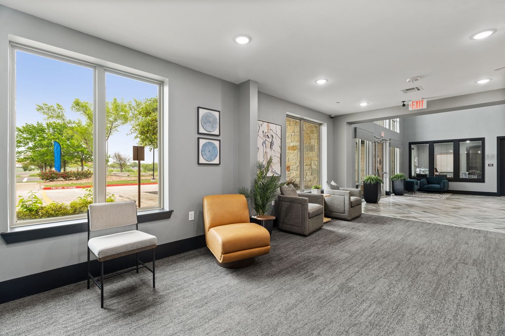 A waiting room with a chair and a bench.