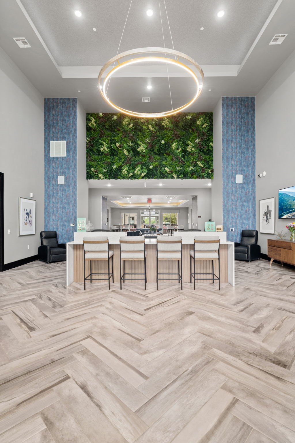 A modern kitchen with a green wall in the background.