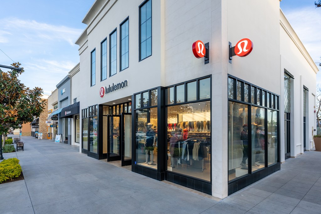 A storefront with a red logo on the top right corner.