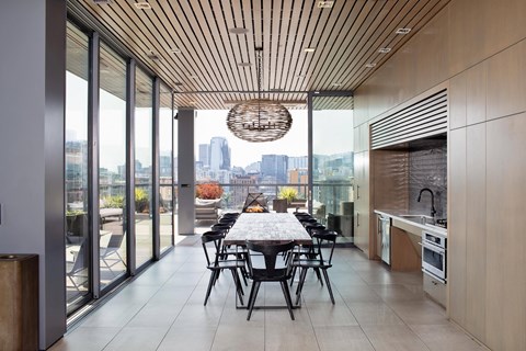 Clubhouse with large dining table at Block 17 Apartments in the Pearl District in Portland, Oregon.
