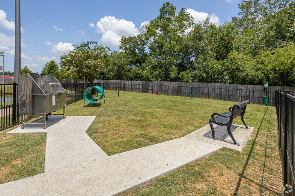 our apartments showcase a dog park with kennel and agility course