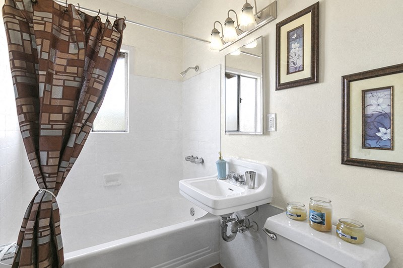 a bathroom with a sink toilet and bathtub