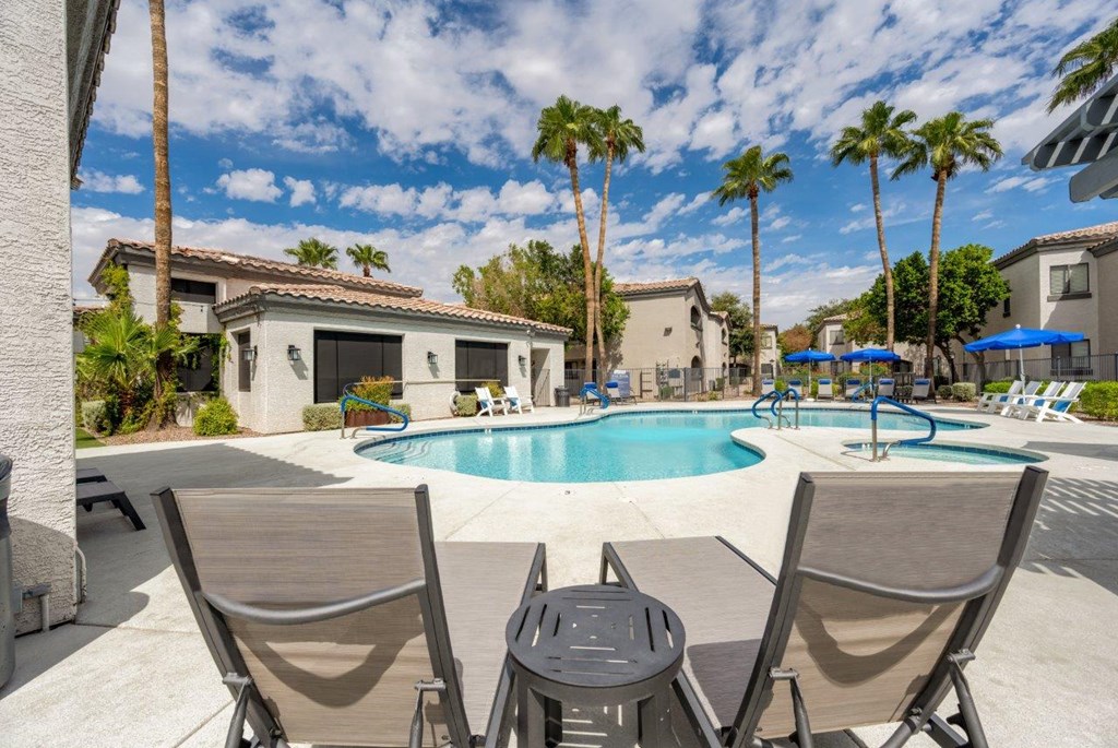 Bayside Apartments Pool with Lounge Chairs