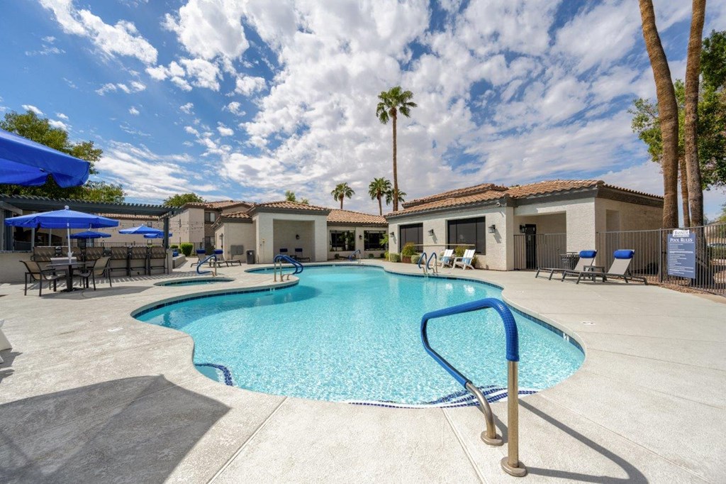 Bayside Apartments Pool with Lounge Chairs