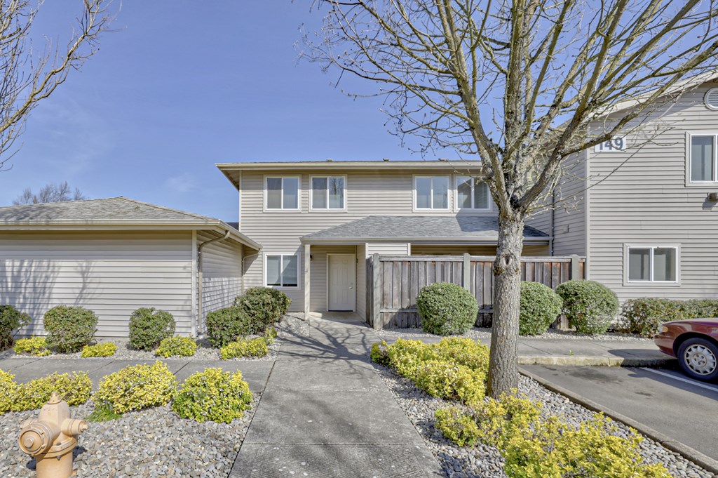 a house with a fire hydrant in front of it