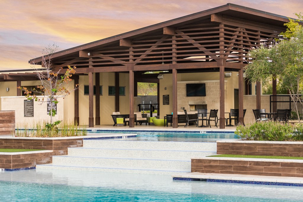 Discovery at the Realm Apartments leasing office with view of pool