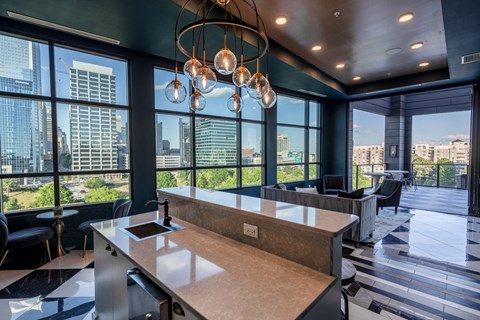a kitchen with a large window view of the city