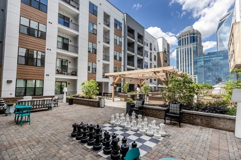 a chess board in the courtyard of an apartment building