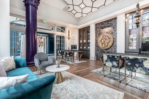a living room with blue couches and a fireplace