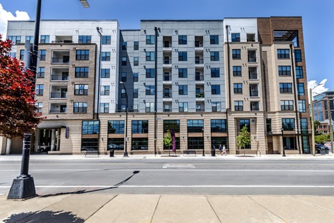 a large building on the corner of a city street