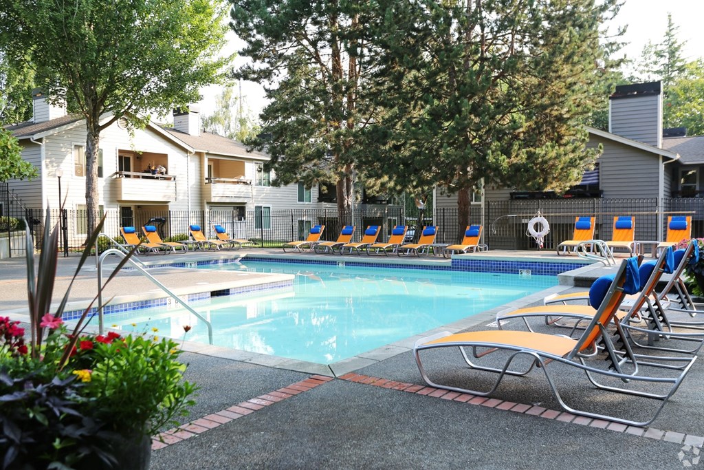 Fulton's Crossing and Landing Apartments resort style pool with lounge chairs