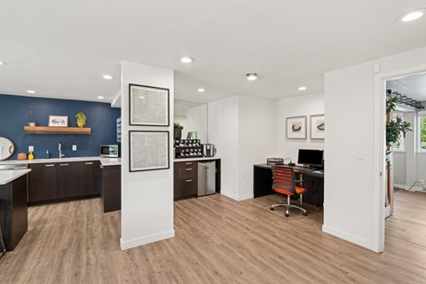 Business Center and Coffee Bar with a desk and a chair in it.