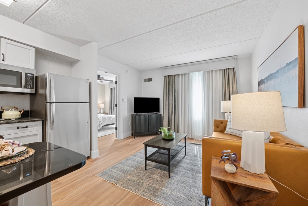 A modern kitchen with a dining table and chairs.