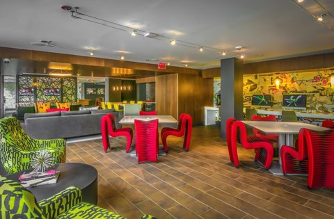 A room with a wooden floor and a mural on the wall.