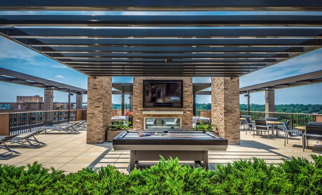 A rooftop with ping pong and seating