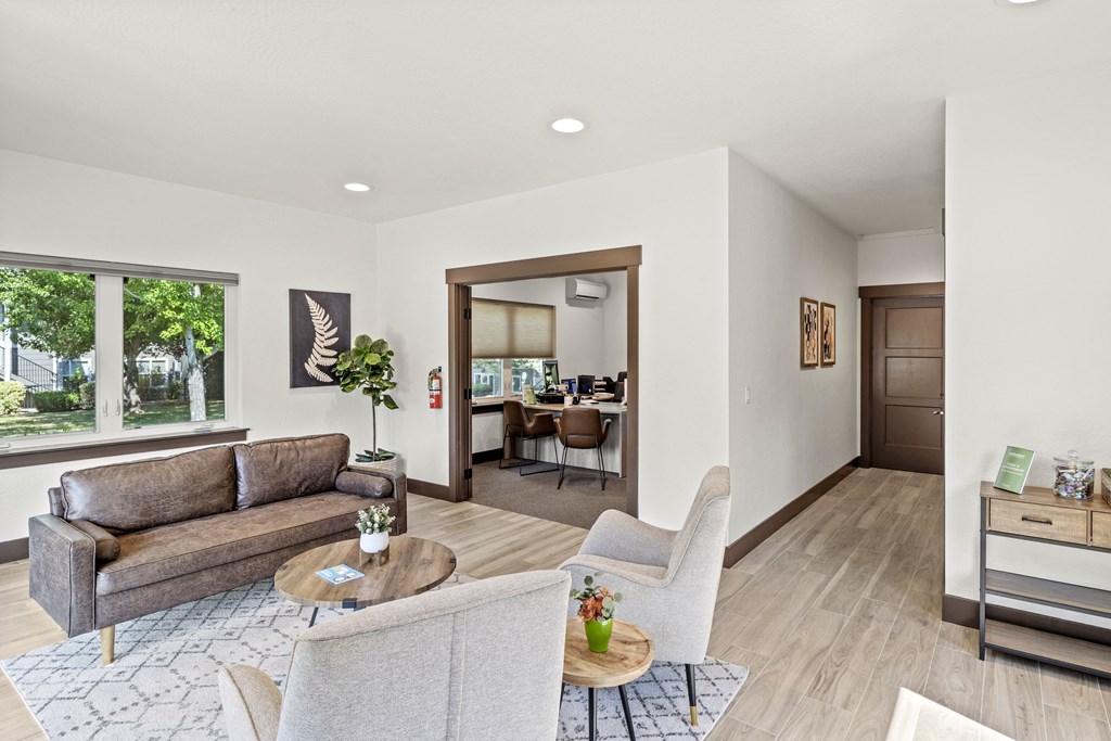 a living room with a couch and two chairs