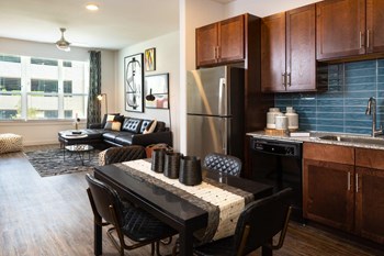 Parkside at Round Rock Apartments Model Kitchen, Dining Room, and Living Room - Photo Gallery 2