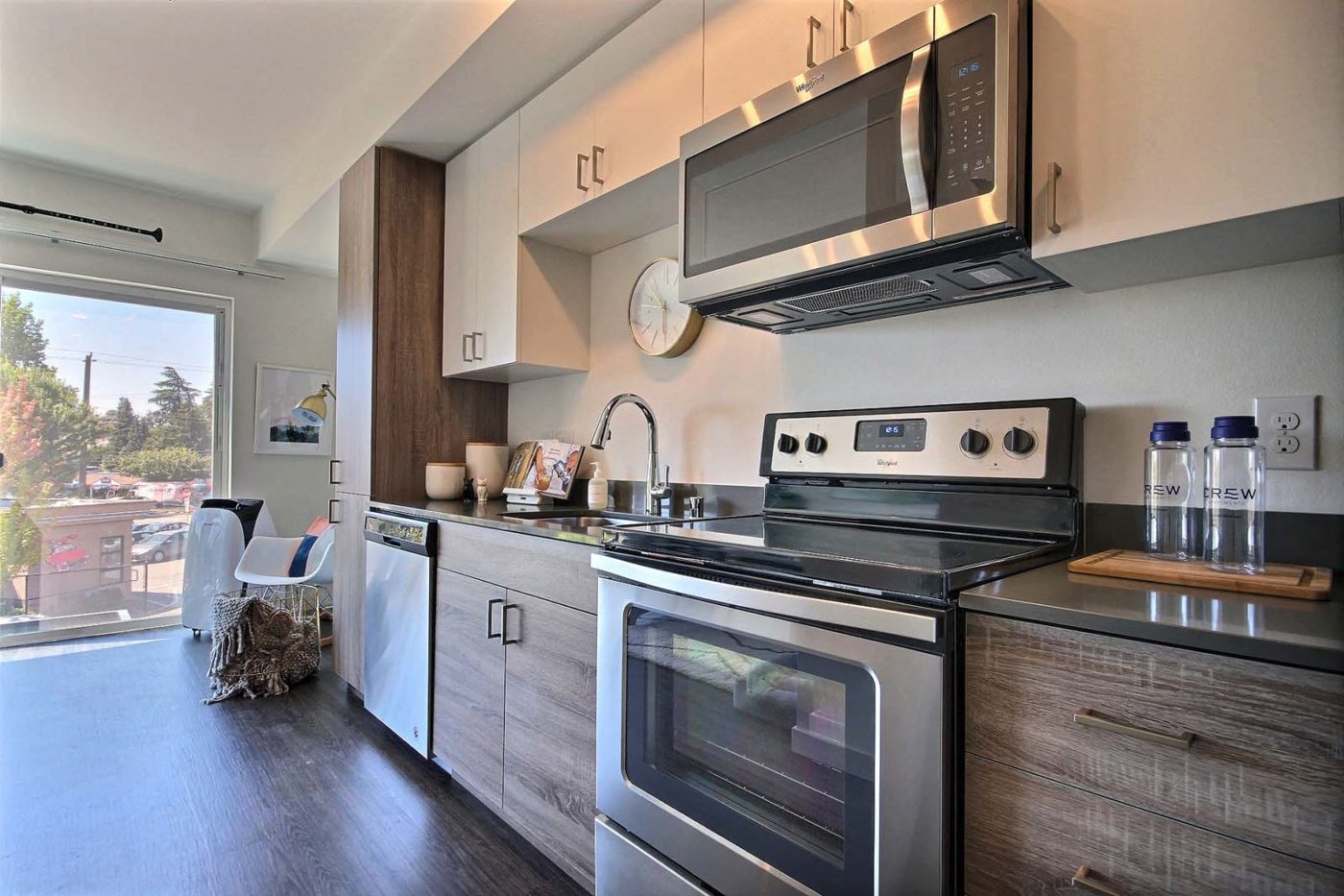 a kitchen with stainless steel appliances and a microwave