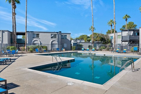 A swimming pool with a slide in the middle of it.