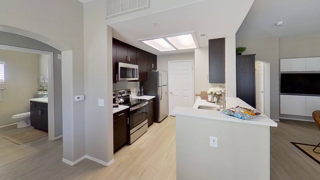 a kitchen and living room in a 555 waverly unit