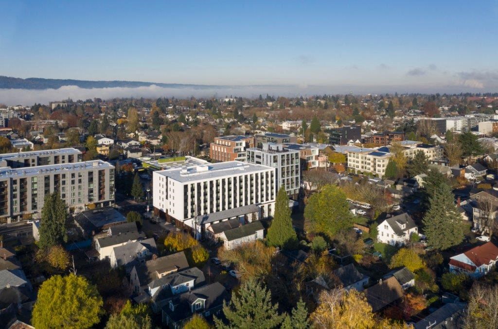 an aerial view of a city with buildings and trees