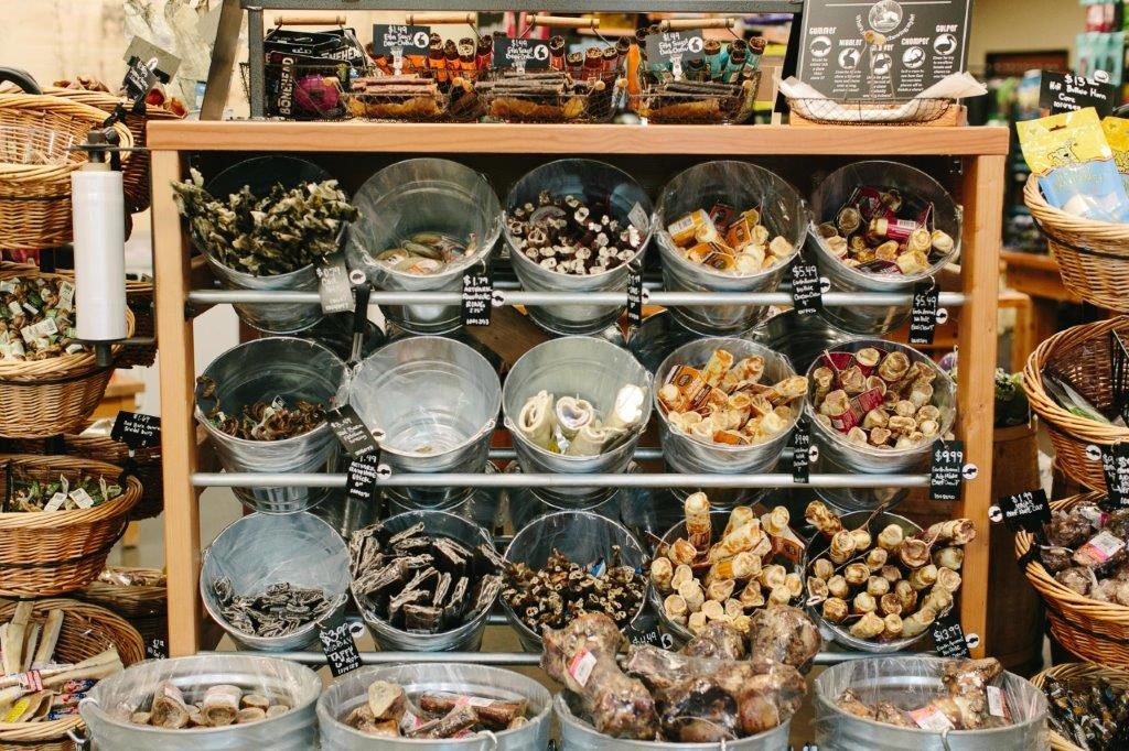 a display case filled with bowls of different types of food